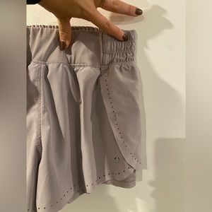 Purple athletic shorts, built in liner